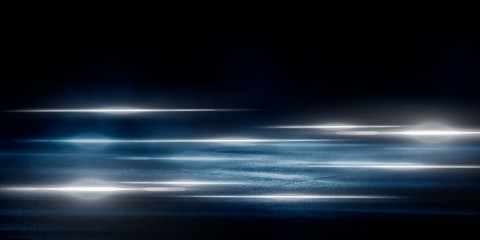 Wet asphalt, reflection of neon lights, a searchlight, smoke. Abstract light in a dark empty street with smoke, smog. Dark background scene of empty street, night view, night city.