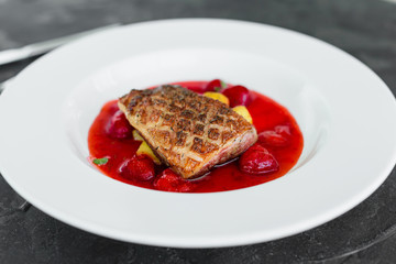 Steak  from fillet of a duck with caramelized strawberry and an eggplant