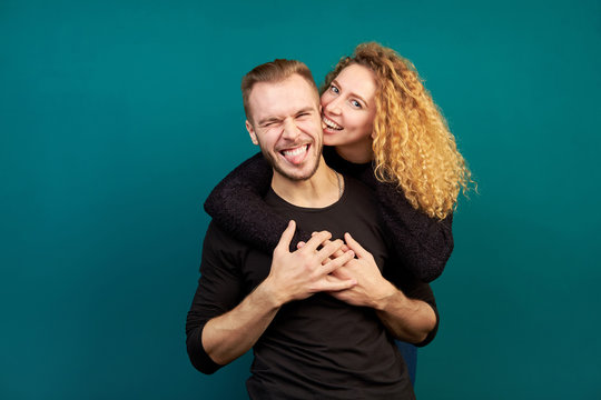 Attractive Young Happy Funny Couple Laughing And Hugging, Have Fun.