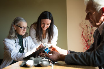 Doctor and her young apprentice with patient