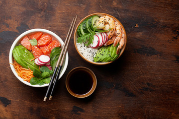 Poke bowl with salmon, shrimps and vegetables