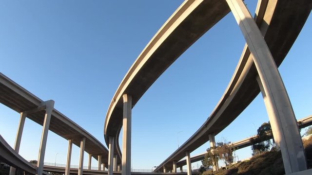 Slow upward driving view of 110 and 105 freeway interchange ramps near downtown Los Angeles, California.  