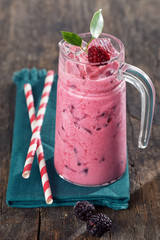 Fresh Berry smoothie on wooden table