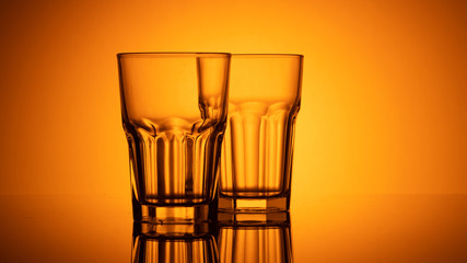 glass of water on color background