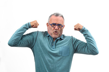 man raising her arms and smiling in victory sign on white background