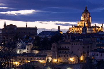 Fototapeta na wymiar View of Segovia with gothic cathedral, typical old houses, city wall. nigth, pinnacles and tower. Segovia, Spain