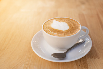 Cup of latte coffee on the table