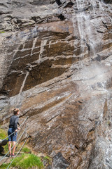 Boy at the waterfall
