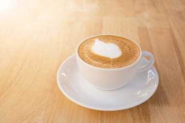Cup of latte coffee on the table