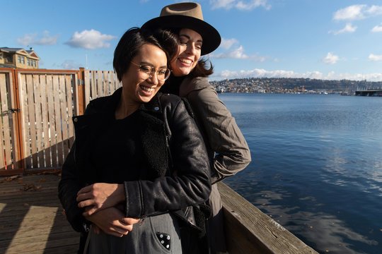 Happy Lesbian Couple Outside Near Water