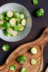 Top view of chopped fresh brussel sprouts on a kitchen table. The concept of healthy vegetarian eating.