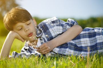 Young boy relaxing outdoors at the park