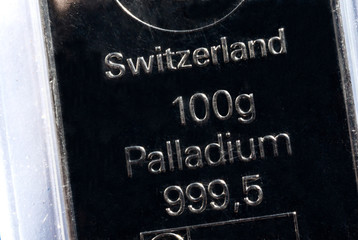 The surface of a palladium ingot. Palladium bar weighing 100 grams.