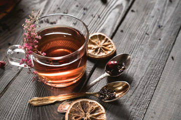Tea cup with tea pot on wooden table
