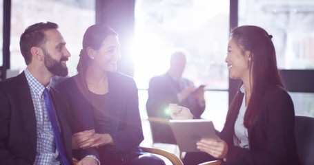 4K Female financial adviser in a meeting with smartly dressed young couple. Slow motion.