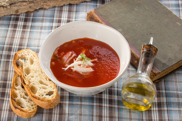 Spanish Traditional cold gazpacho soup with crab meat on textile napkin
