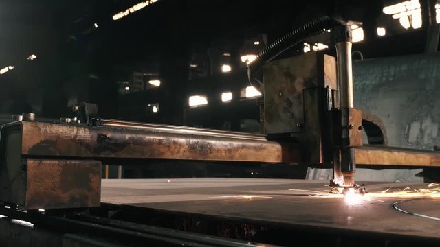 Metal Cutting Machine Cuts Round Parts On A Sheet Of Metal