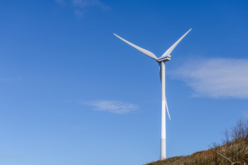 wind turbine against a blue sky