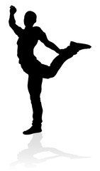 A male street dance hip hop dancer in silhouette