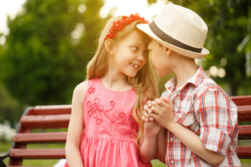 Happy little kids having fun outdoors at the park