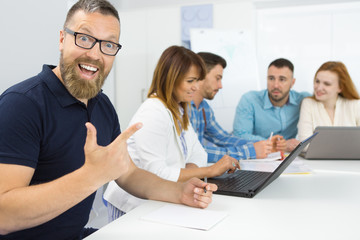 Businessman in a meeting with his colleagues at the office