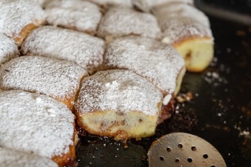 Baked stuffed cakes with marmalade and sugar. Home made. Slovakia