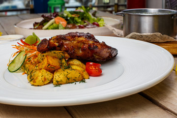 View from above of georgian cuisine on brown wooden table. Traditional georgian cuisine and food - khinkali, kharcho, chahokhbili, phali, lobio and local sauces - tkemali, satsebeli, adzhika. Top view