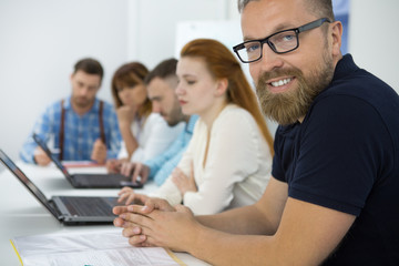 Businessman in a meeting with his colleagues at the office
