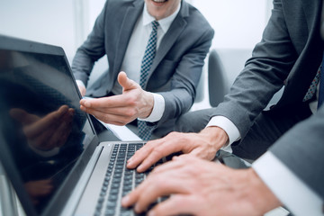 close up.two businessmen discussing the text of the document