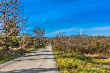 View of a wind turbines on top of mountains