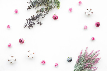 Cotton flowers, eucalyptus branch, lavender, pink rose on white background, flat lay, top view