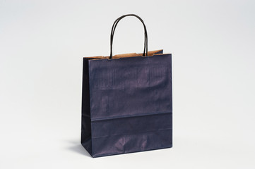 Blue paper craft bag with handles for shopping in the studio
