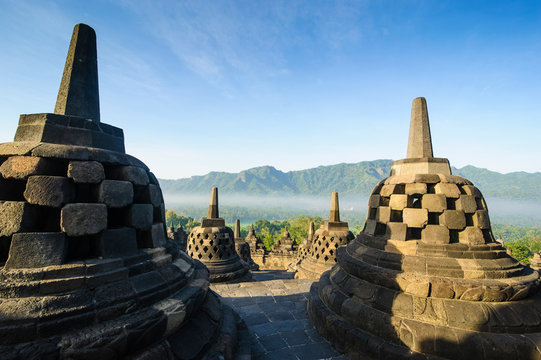 Indonesia, Java, Borobudur Temple Complex, stupas in early morning light