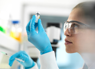 Doctor preparing a vaccine for a patient