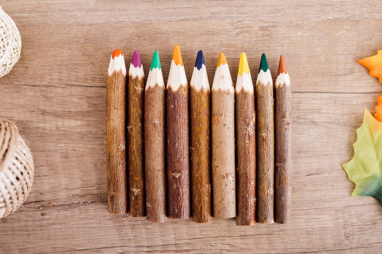 Wooden colored pencils in a row