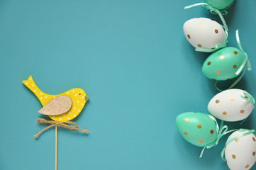 Easter eggs are white blue polka dots. Festive mood. Easter attributes. Easter food. Drawing on the eggs. Blue background