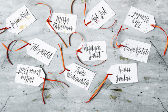 Merry Christmas wrote in several languages, DIY gift tags
