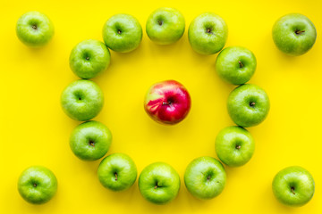 green apples for organic summer food pattern on yellow background top view