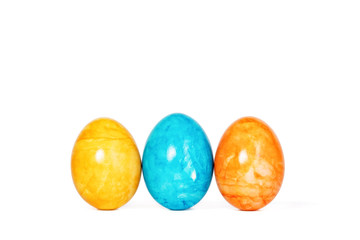 Obraz premium Different decorative Easter eggs in a row isolated on white background
