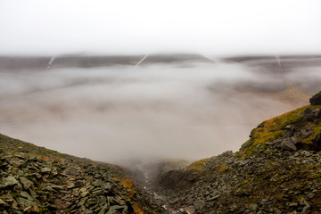 Hiking along the Ridge, Bjorndalen in Front, clouds hang on the mountains, Fall in Spitzbergen, Svalbard, Norway