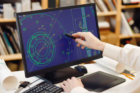 Engineer Working On Computer At The Design Of Cad Scheme.