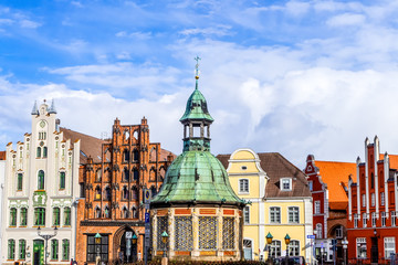 Wismar on the market square with water art and historic facades