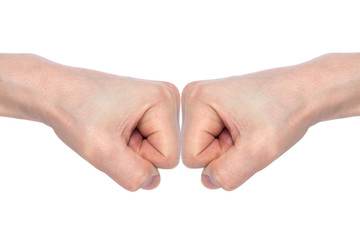Two male fists hitting each other, isolated on white background. The concept of business success and teamwork. Close-up