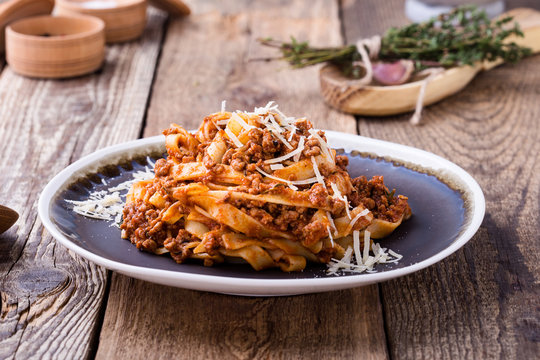 Fettuccine pasta with bolognese sauce and thyme