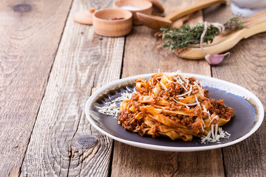 Fettuccine pasta with bolognese sauce and thyme