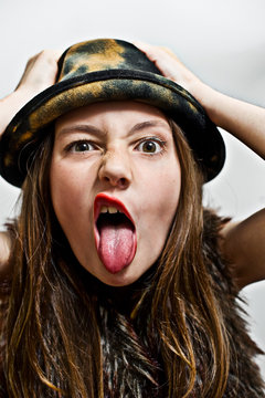 Portrait of girl sticking out tongue