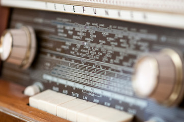 old radio receiver with antique knobs