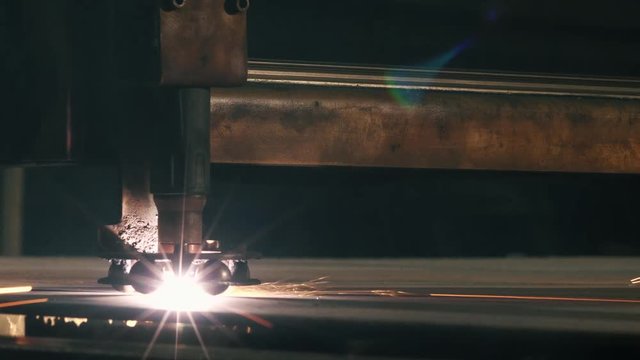 Close-up Laser Cutting Machine Cuts A Sheet Of Metal
