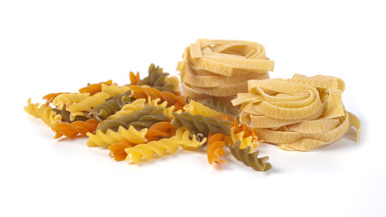 Colored italian pasta isolated on white background
