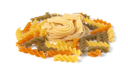 Colored italian pasta isolated on white background